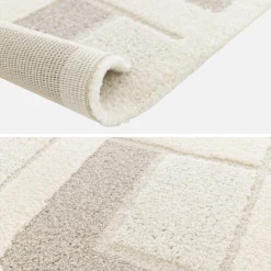 Crèmekleurig vloerkleed met geometrische patronen