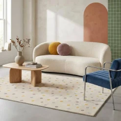 Kinderkleed met stippen, crème, blauw, geel en paars