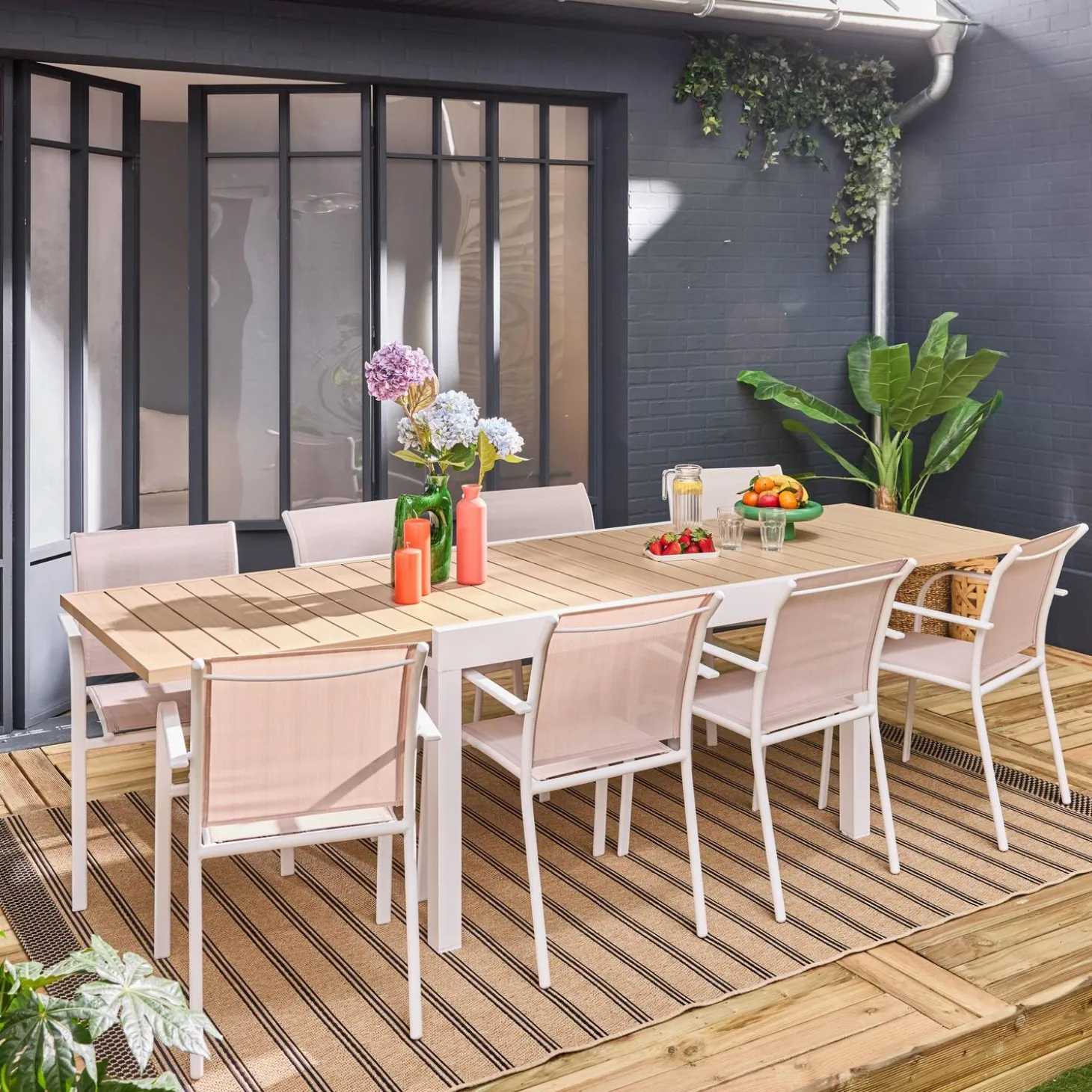 Verlengbare tuintafel met 8 stoelen van aluminium en textileen