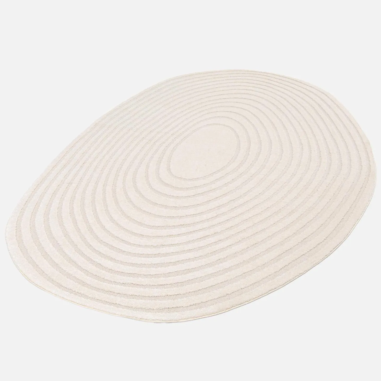 Vloerkleed in de vorm van een kiezelsteen met crèmekleurig cirkelpatroon voor binnen