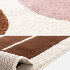 Vloerkleed met roze en bruin grafisch patroon voor binnen